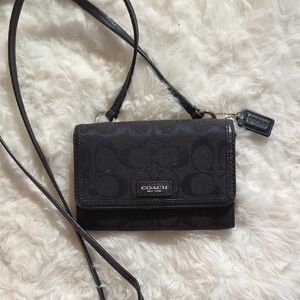 Coach Black Crossbody Bag with Sleek Design and Long Strap